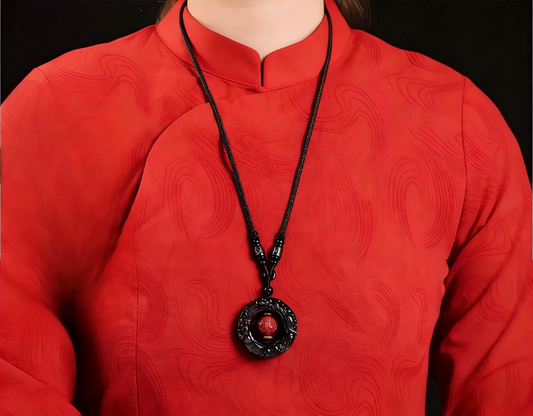 Wearing Black Obsidian Pixiu pendant on right wrist, Pixiu facing outward for wealth attraction